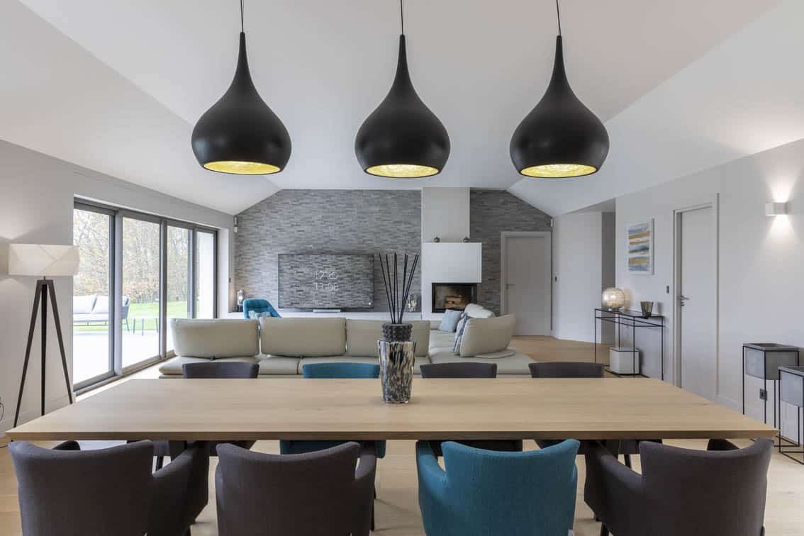 View from the dining room to the living room, black drop effect suspensions, by Christiansen Design, Interior designer Yvelines and Decorator in Paris, Hauts de Seine, Provence